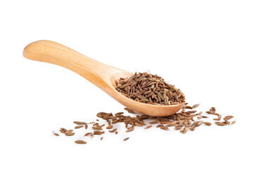 Seeds of dry cumin seasoning on a wooden spoon isolated on a white background with seeds scattered...