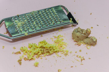 Cook grating fresh ginger root