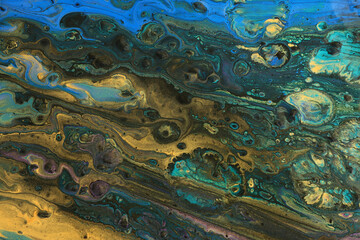 art photography of abstract marbleized effect background with turquoise, green, black and gold creative colors. Beautiful paint.