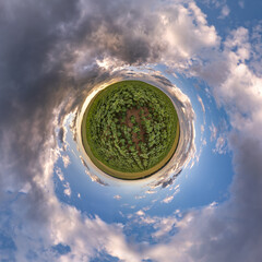 simple tiny planet without buildings in blue sky with beautiful clouds. Transformation of spherical...
