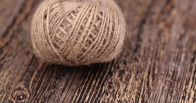 rough linen rope close-up, rough rope on a wooden table