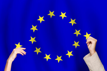Joining the European Union. EU flag and hand with star