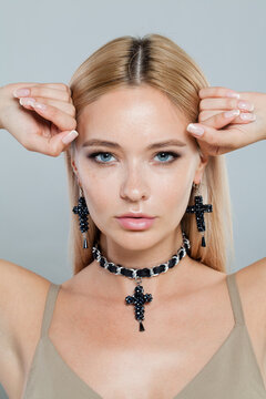 Close up face of fashion jewelry model woman. Lady with fresh clean skin, blonde hair and necklace on her neck