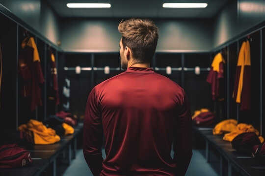 Soccer player in red contemplating in locker room