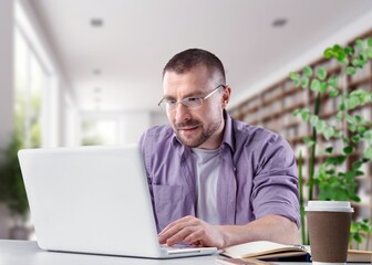 Young student man studying at home