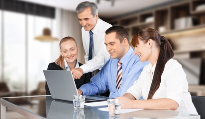 Group of happy business colleagues in modern co working