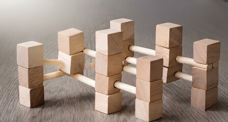 Wooden blocks connected together on a blue background. Teamwork concept