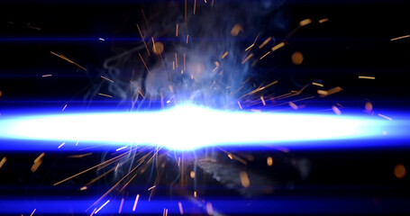 sparks from welding metal at a construction site. 