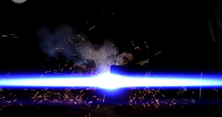 Welding of metal structures with sparks, close-up.