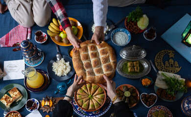 Ramadan Iftar Table. Muslim Family Having Dinner At Home. Iftar Table with Traditional Food. Fasting ends with Dates. Ramadan Feast Celebrations, Eid Mubarak Concept Uskudar Istanbul, Turkiye (Turkey)