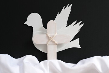 White wooden cross and fabric as symbol of heaven. Funeral and burial backdrop and sympathy card...