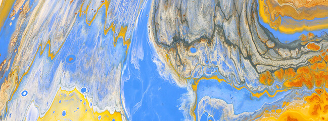 art photography of abstract marbleized effect background with yellow, blue, gold and copper...