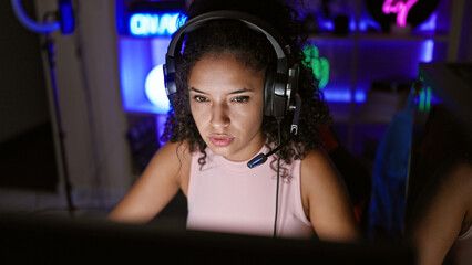 Stunning young hispanic woman streamer dominates the gaming landscape, an intimate night of serious...