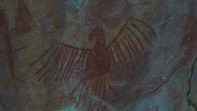 Prehistoric primitive cave art. Red painting of lizard on wall in Brazil