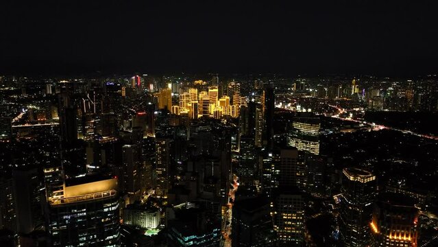 Makati Skyline. Illuminated Buildings and Business Center District at Night. Metro Manila. Philippines.