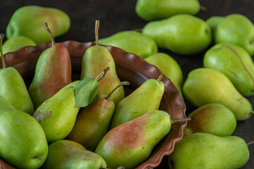 Parisian pear variety. Fruits on the table. Autumn harvest. Pears top view background. Green yellow red color pear. Vitamin vegan food.