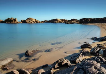 Foto op Plexiglas Cala Pregonda, Menorca Eiland, Spanje golden sand beach and turquoise waters at the idyllic Cala Pregonda in northern Menorca
