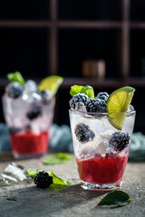 Blackberry lime mojito with mint and ice