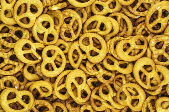 Salted mini pretzels texture background above