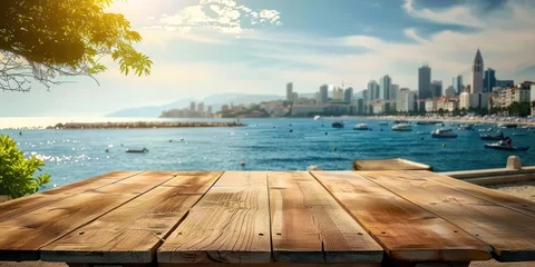 Fototapeten Empty wooden table with blurred dock background perfect for displaying travel and seaside products summer with scenic ocean view embodying beauty and tranquility of tropical beach landscape © Bussakon