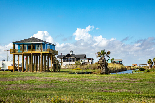 new beach house   at Port Bolivar on wooden stilts to protect against flooding, Texas