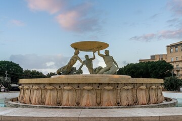 view of the Triton Fountain in downtown Valletta at sunrise