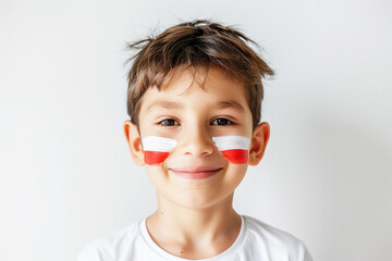 Photo of boy male fan with Polish flags painted on her cheeks - obrazy, fototapety, plakaty
