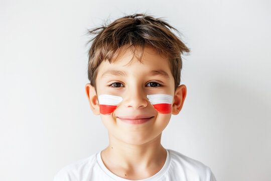 Photo of boy male fan with Polish flags painted on her cheeks