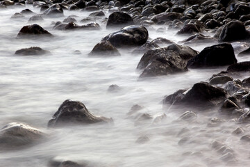 Long-exposure view of the surf at the pebble beach