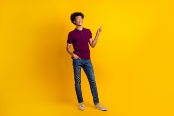 Fototapeta na wymiar Photo of nice attractive man wear trendy clothes look up empty space presents store mall isolated on yellow color background