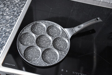 Teflon black pancake pan. Frying pan for 7 fritters