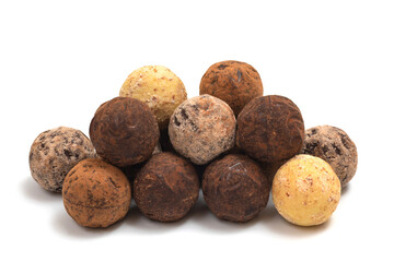 Various chocolate candies close-up. Belgian truffles on a white background
