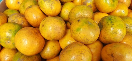 Pile oranges fruit background. Sold in traditional market Indonesia