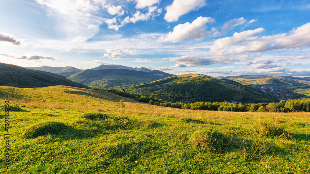 Canvas Prints rural landscape with grassy meadows. distant mountain range beneath a sky with clouds. beautiful sce