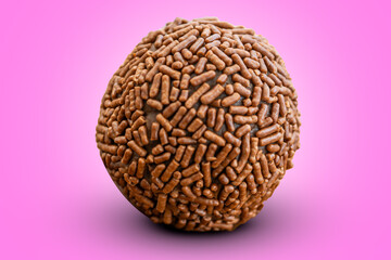 brigadeiro, brazilian sweet snack dessert on a pink background