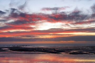 Low tide and sunset on Hauteville-sur-Mer beach.Cotentin coast