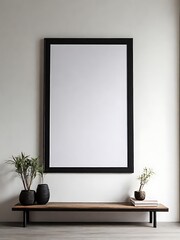 empty black wooden frame filled with white matte board hanging on blank wall