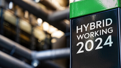 Hybrid working 2024 on a sign in front of an Industrial building	