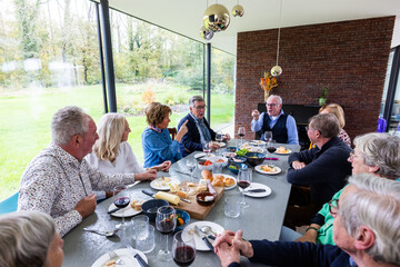 This engaging photo captures a family enjoying a convivial brunch in a modern dining room that...
