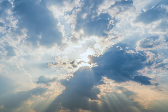dramatic sunshine through cloudscape. Tyndall light effect. 