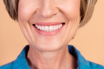 Close up photo of good mood senior woman with bob hairstyle toothy smiling demonstrate healty teeth isolated on pastel color background