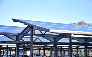 Solar panels are installed on the roof of the parking lot. 