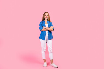 Full length photo of sweet charming girl wear blue shirt arms folded empty space isolated pink color background