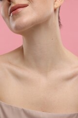 Beauty concept. Woman on pink background, closeup