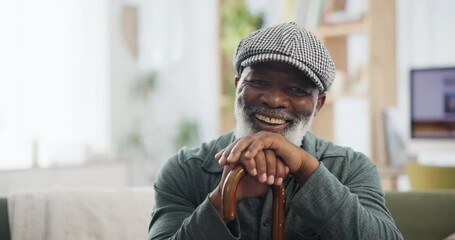 Face, cane and and senior black man with disability on sofa in living room of retirement home to relax. Portrait, funny and elderly person laughing in apartment with wooden walking stick for balance - Powered by Adobe