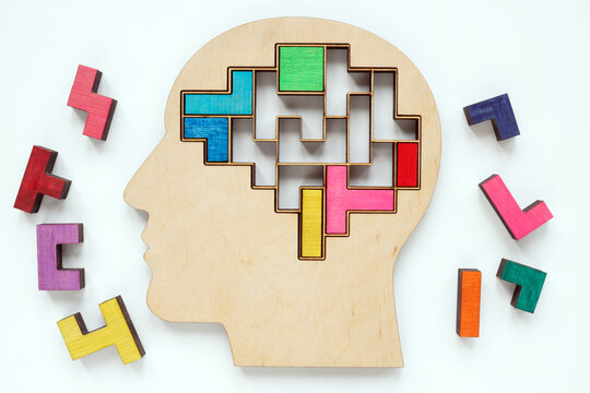 Head and pieces of a colored puzzle. Autism or neurodiversity concept.