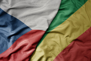 big waving national colorful flag of republic of the congo and national flag of czech republic.