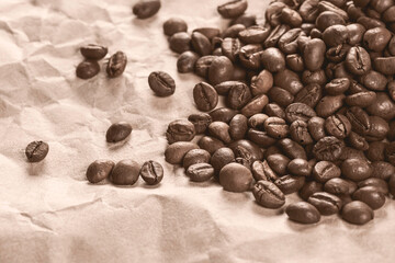 Coffee grains on eco paper. Morning with fresh coffee. Hot drink. Storage and drying of coffee.