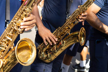 Musicians playing the saxophone are seen at the Fuzue pre-carnival parade in the city of Salvador, Bahia. - obrazy, fototapety, plakaty