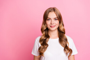 Portrait photo of young charming brown hair girl in white t shirt cute smiling glad model isolated on pastel pink color background